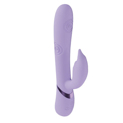 Purple silicone butt plug with spiral patterns on a white background