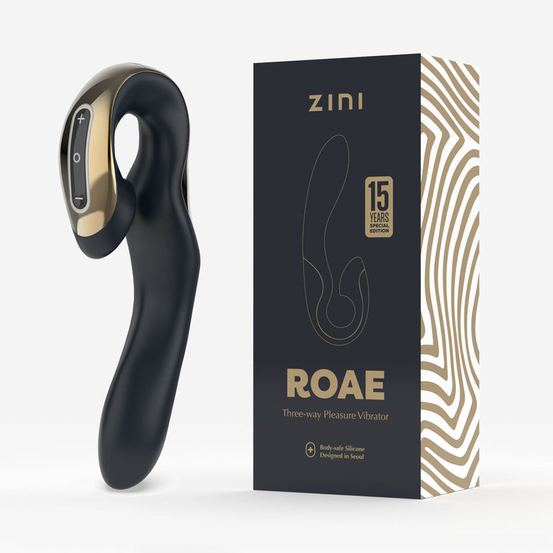 Black and gold pleasure vibrator with Zini packaging on a white background