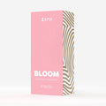 Zini Bloom product packaging with pink and gold design on a white background